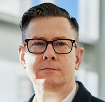 暗号資産取引会社のCEOを務めるAlexander Hughes、役員のポートレート